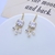 Picture of Copper or Brass Cubic Zirconia Dangle Earrings at Unbeatable Price